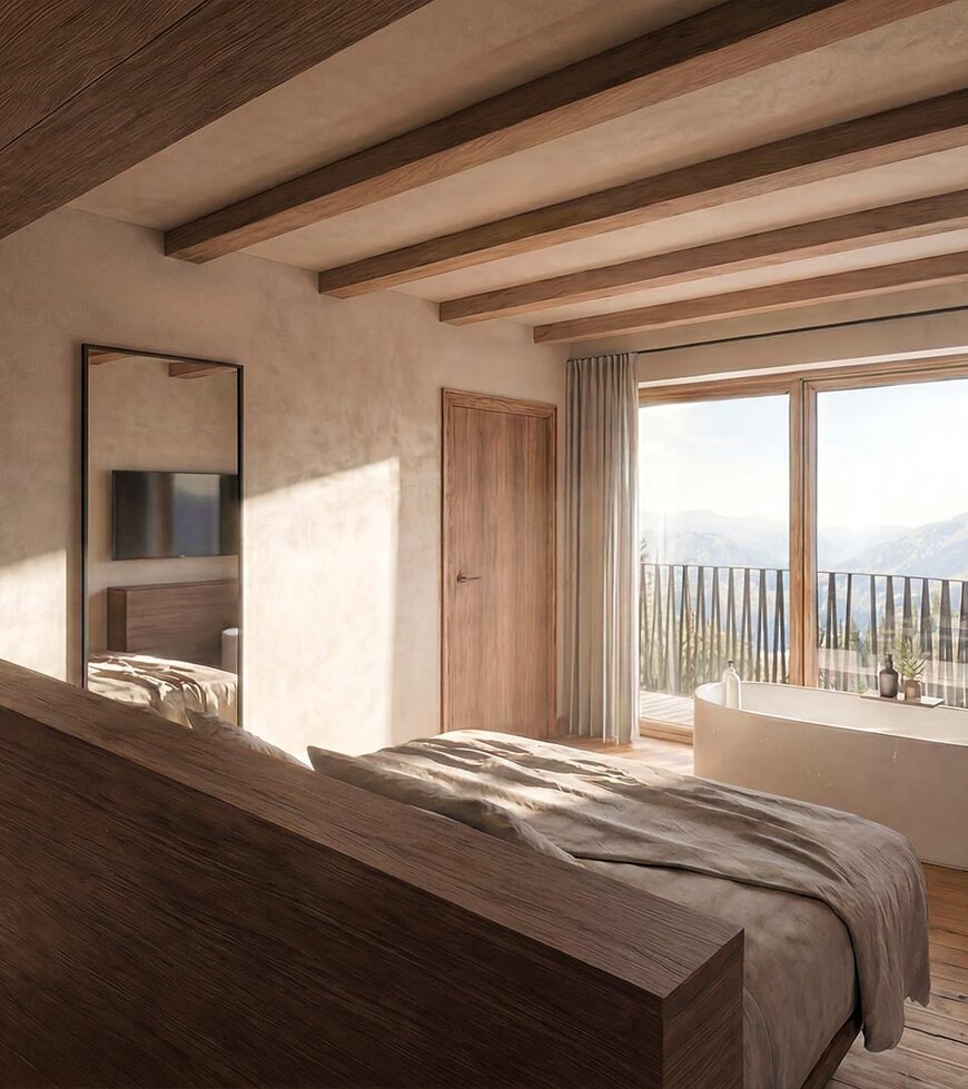 thegreen-zimmer-watersuites-2 Schlafzimmer mit großem Bett, Holzwänden und -boden, Zugang zu Balkon mit Sitzmöbeln